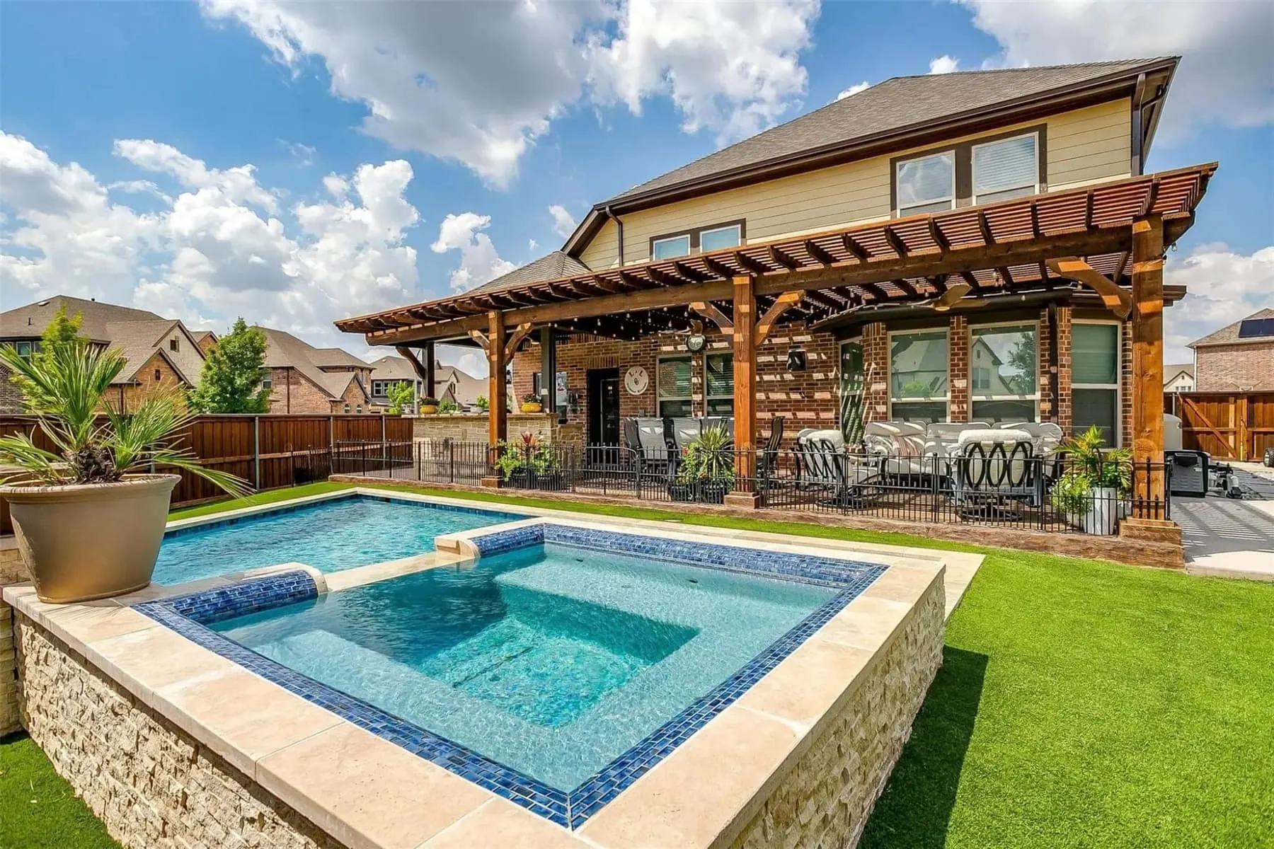 Covered outdoor living patio overlooking custom pool in Southlake Texas